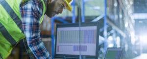 man at desk in warehouse image