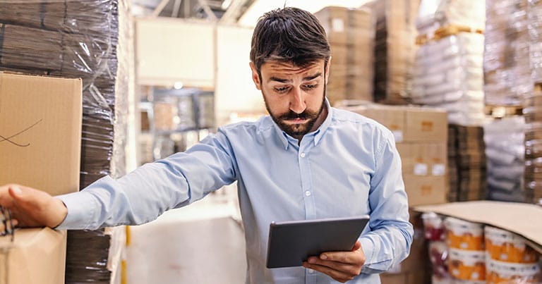 person weighing up choice of FMS platforms