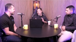 Sam Rowse, Greg Amanatidis and Jamal Kanj discuss freight around a round table in a podcast recording studio for the Supply Chain Unchained podcast.