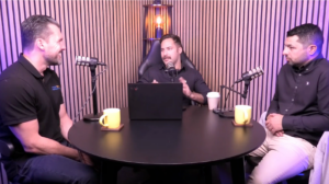 Sam Rowse, Greg Amanatidis and Jamal Kanj discuss freight around a round table in a podcast recording studio for the Supply Chain Unchained podcast.